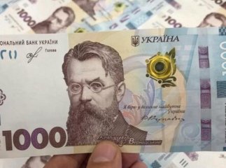 Третій банк почав нараховувати тисячу за вакцинацію